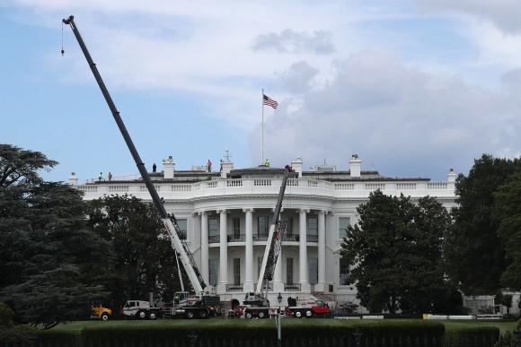 Cranes are seen on the South Lawn of the White House Aug. 8, 2017 in Washington, DC. The White House underwent a major renovation while President Donald Trump stayed in Bedminster, New Jersey, with an upgrade of the HVAC system in the West Wing, the South Portico steps, the Navy mess kitchen, and the lower lobby. (Alex Wong/Getty Images)