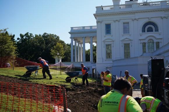 Workers are seen on the lawn outside of the Brady Briefing Room as the White House undergoes renovations on August 9, 2017. President Donald Trump mostly stayed at his golf resort in New Jersey during the renovations. (MANDEL NGAN/AFP/Getty Images)