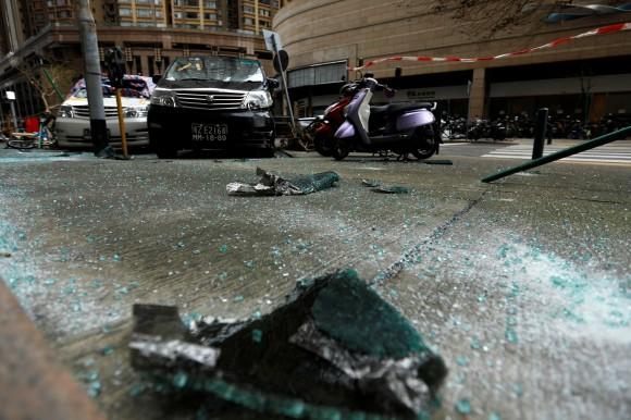 Debris from a piece of glass whcih fell from an apartment is seen as Tropical storm Pakhar hits Macau, China August 27, 2017. (Reuters/Tyrone Siu)