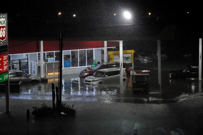 Cars sit abandoned at a flooded gas station after Hurricane Harvey made landfall on the Texas Gulf coast and brought heavy rain to the region, in Houston, Texas, U.S. on Aug. 26, 2017. (REUTERS/Nick Oxford)