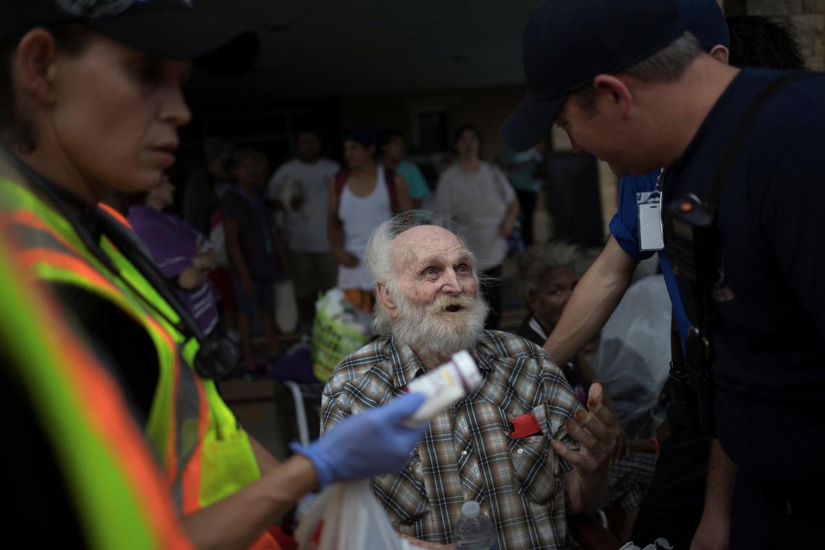 A man is assisted by medics as he is evacuated after losing his home to Hurricane Harvey in Rockport, Texas, U.S. on Aug. 26, 2017. (REUTERS/Adrees Latif)