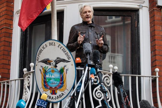 WikiLeaks founder Julian Assange speaks to the media from the balcony of the Ecuadorean Embassy in London on May 19, 2017. (Jack Taylor/Getty Images)