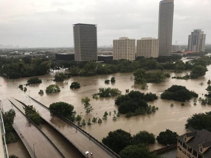 Flooded downtown is seen from a high rise along Buffalo Bayou after Hurricane Harvey inundated the Texas Gulf coast with rain causing widespread flooding, in Houston, Texas, U.S. on Aug. 27, 2017. (Twitter/@caroleenarn via REUTERS)