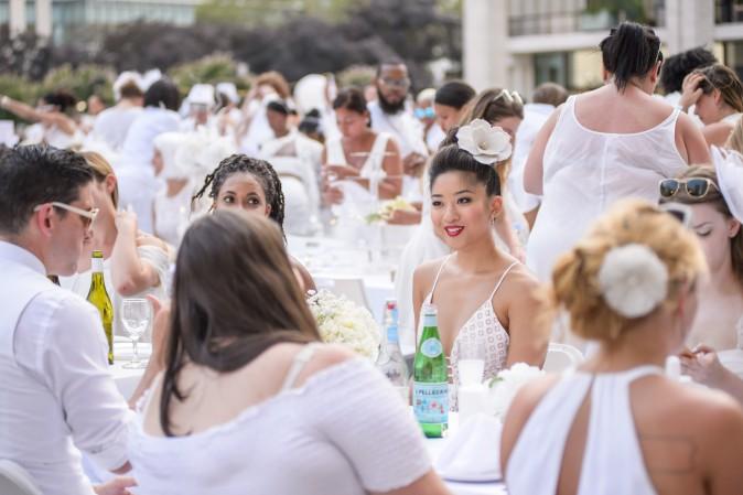 Guests attend the annual Diner en Blanc at Lincoln Center in New York on Aug. 22, 2017. Diner en Blanc began in France nearly 30 years ago and is held around the world. (Jane Kratochvil for Diner en Blanc)