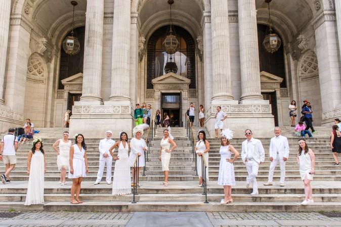 Attendees of Diner en Blanc meet at the New York Public Library before heading to the Lincoln Center for annual event on Aug. 22, 2017. (Jane Kratochvil for Diner en Blanc)