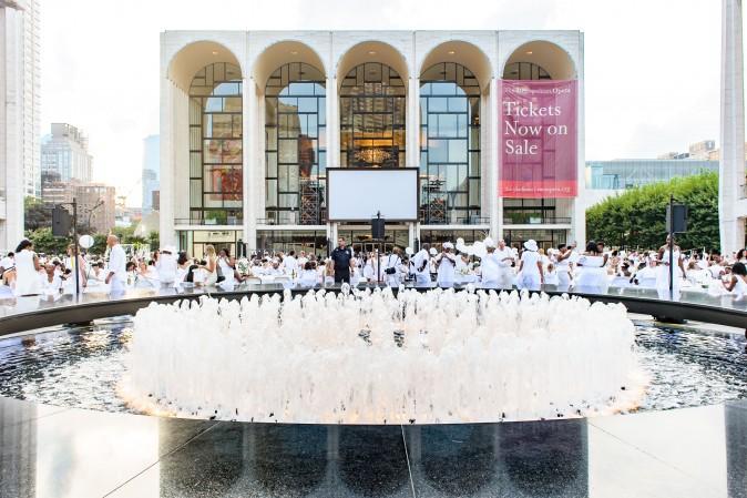 Guests attend the annual Diner en Blanc at Lincoln Center in New York on Aug. 22, 2017. Diner en Blanc began in France nearly 30 years ago and is held around the world. (Jane Kratochvil for Diner en Blank)