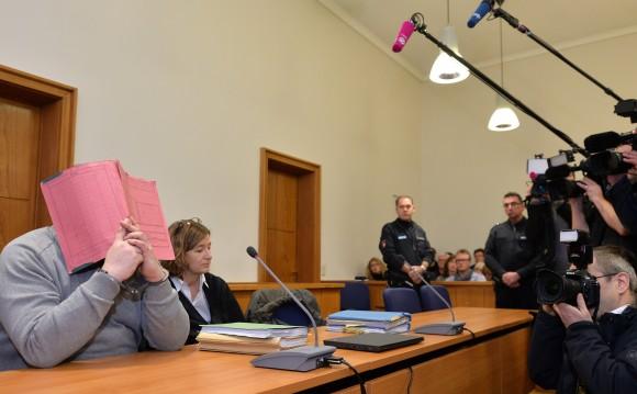 German former male nurse Niels H (L) waits next to his lawyer Ulrike Baumann (2nd L) for the opening of another session of his trial on Feb. 26, 2015, at court in Oldenburg, northwestern Germany. (Carmen Jaspersen/AFP/Getty Images)