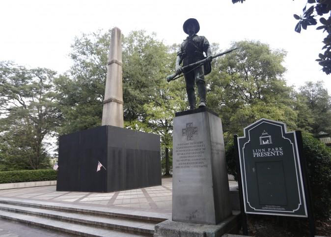 A monument to volunteers of the Army of the Republic stands next to a confederate monument covered up by the mayor of Birmingham in Linn Park August 18, 2017 in Birmingham, Alabama. (Photo by Hal Yeager/Getty Images)
