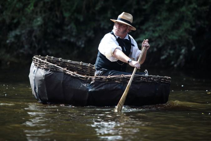 Coracler Conwy Richards from Norfolk takes part in the 30th annual Ironbridge Coracle Regatta on the River Severn in Ironbridge, United Kingdom, on Aug. 28, 2017. A coracle is a small boat made from an interwoven wooden frame and is used traditionally for fishing or transportation. (Jack Taylor/Getty Images)