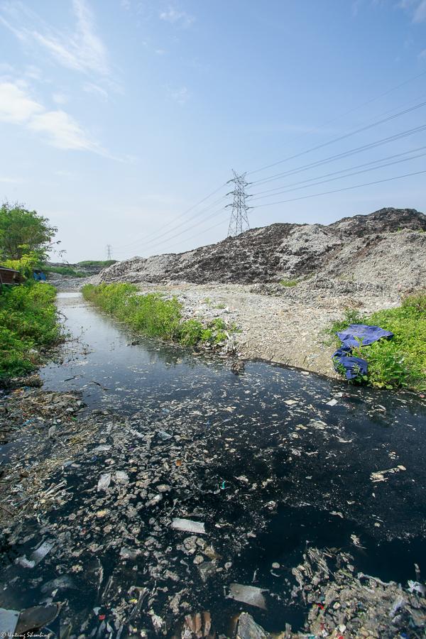 Water along the shore of the Ciujung River, where pulp and paper mill PT Indah Kiat dumps its waste. Local residents have protested the company's pollution of their main water source. (Indonesian Center for Environmental Law)