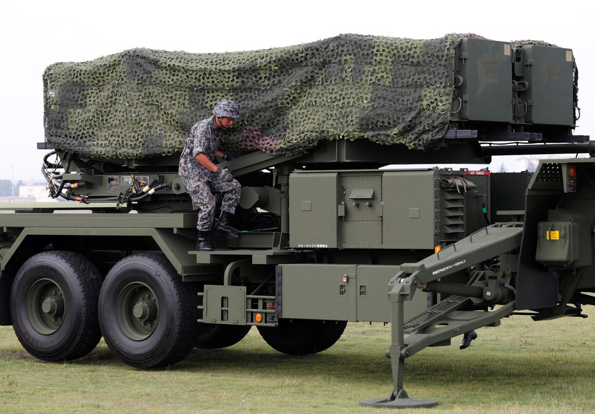 A Japan Self-Defense Forces (JSDF) soldier takes part in a drill to mobilise their Patriot Advanced Capability-3 (PAC-3) missile unit in response to a recent missile launch by North Korea, at U.S. Air Force Yokota Air Base in Fussa on the outskirts of Tokyo, Japan on Aug. 29, 2017. (REUTERS/Issei Kato)
