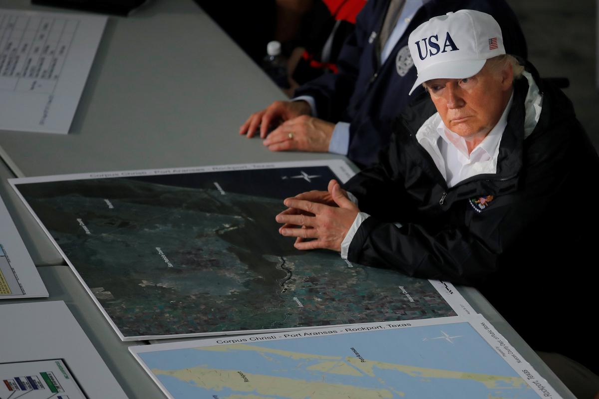 U.S. President Donald Trump receives a briefing on Tropical Storm Harvey relief efforts in Corpus Christi, Texas, U.S., August 29, 2017. (REUTERS/Carlos Barria)