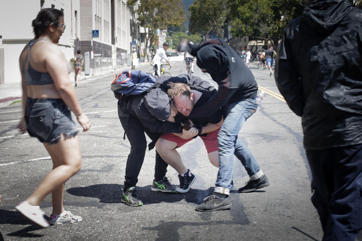 Antifa extremists attack a Trump supporter at Martin Luther King Jr. Civic Center Park in Berkeley, Calif., on Aug. 27, 2017. (Elijah Nouvelage/Getty Images)
