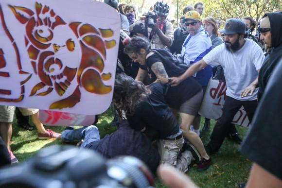 Antifa extremists attack a man at Martin Luther King Jr. Civic Center Park in Berkeley, Calif., on Aug. 27, 2017. (AMY OSBORNE/AFP/Getty Images)