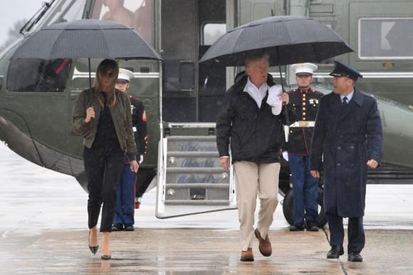 US President Donald Trump and First Lady Melania Trump walk to board Air Force One at Andrews Air Force Base, Maryland, on August 29, 2017 en route to Texas to view the damage caused by Hurricane Harvey. (JIM WATSON/AFP/Getty Images)