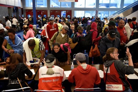 Volunteers with The American Red Cross register evacuees at the George R. Brown Convention Center after Hurricane Harvey inundated the Texas Gulf coast with rain causing widespread flooding, in Houston, Texas, U.S. August 28, 2017. (Reuters/Nick Oxford)