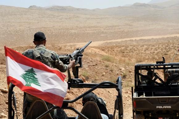 Lebanese Army soldiers ride on their military vehicles in Ras Baalbek, Lebanon August 28, 2017. (Reuters/Hassan Abdallah)