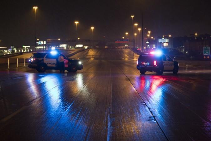 Houston Police block Interstate 10 East early Monday morning near the junction with Loop 610 due to high water from Hurricane Harvey Aug. 28, 2017, in Houston, Texas. (Erich Schlegel/Getty Images)
