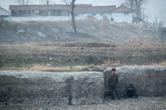 North Korean soldiers are on the banks of the Yalu River near Sinuiju, opposite the Chinese border city of Dandong, on April 15, 2017. (Johannes Eisele/AFP/Getty Images)