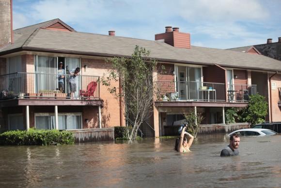 Residents wait for rescue at an apartment complex after it was inundated with water following Hurricane Harvey on Aug. 30, 2017, in Houston, Texas. (Scott Olson/Getty Images)