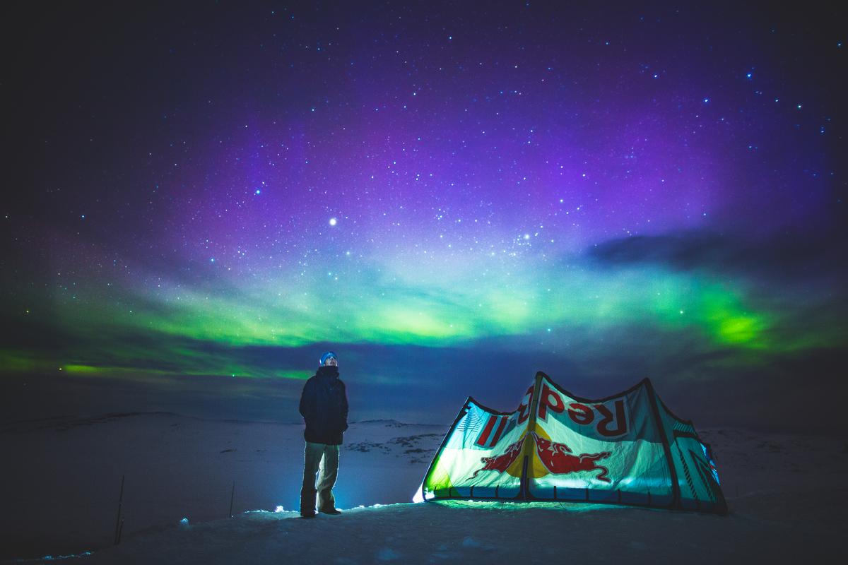 Christoph Tack watches the northern light during Red Bull Ragnarok at Hardangervidda in Haugastol , Norway on April 10, 2015. (Mats Grimsæth / Red Bull Content Pool)