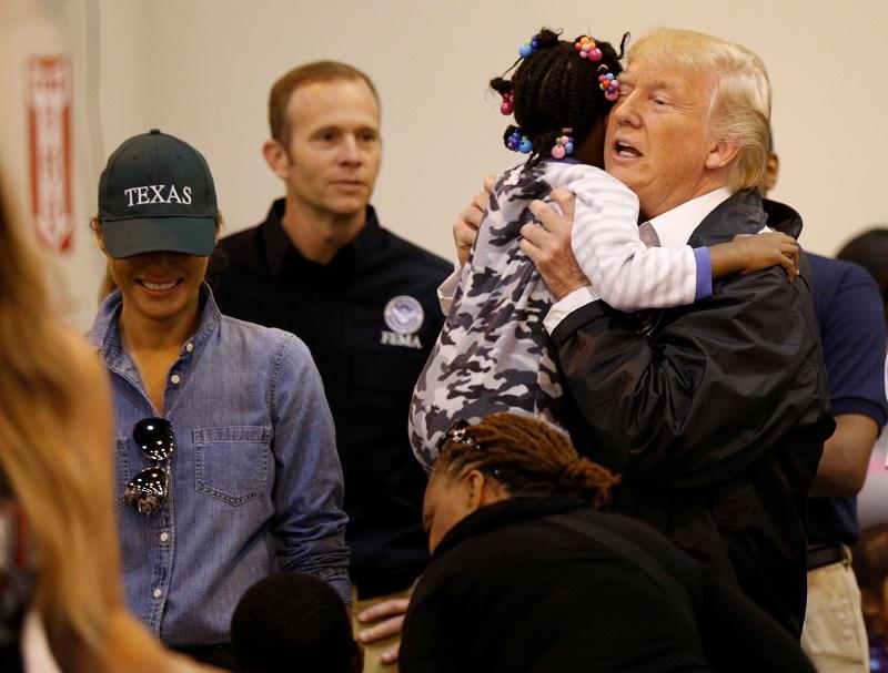 President Donald Trump and first lady Melania Trump greet children at the NRG Center where they met with flood survivors of Hurricane Harvey, in Houston, Texas on Sept. 2, 2017. (REUTERS/Kevin Lamarque)