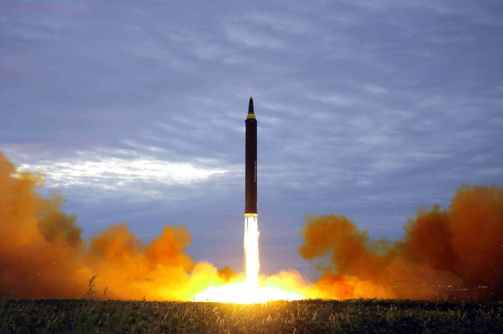 This picture from North Korea's official Korean Central News Agency shows North Korea's intermediate-range strategic ballistic rocket Hwasong-12 lifting off from the launching pad at an undisclosed location near Pyongyang. (Photo credit should read STR/AFP/Getty Images)