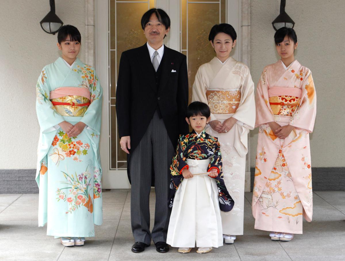 Japan's Prince Hisahito (C) wearing traditional ceremonial attire is accompanied by his father Prince Akishino (2nd L), mother Princess Kiko (centre R) and sisters Princess Mako (L) Princess Kako (R) after the Chakko-no-Gi and Fukasogi-no-gi ceremonies at the Akasaka imperial estate in Tokyo on Nov. 3, 2011. (ISSEI KATO/AFP/Getty Images)