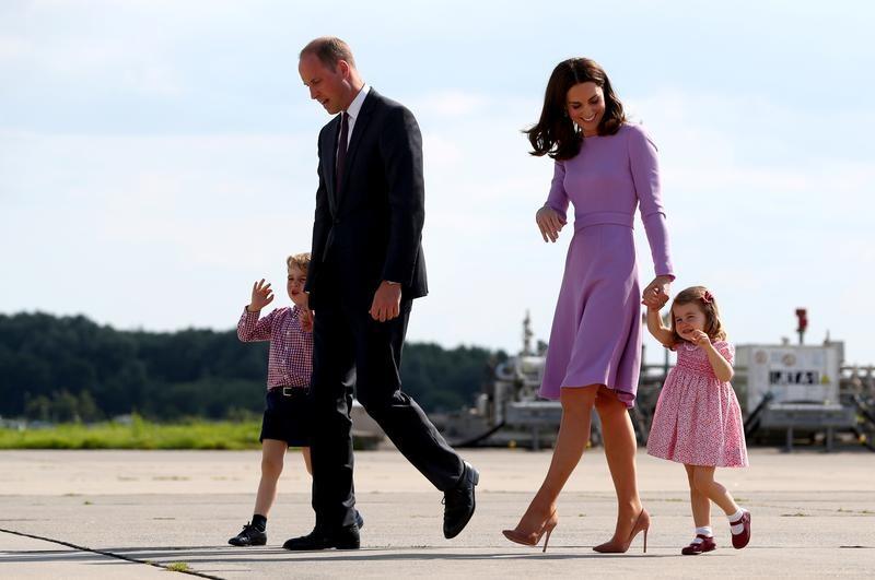 Britain's Prince William, the Duke of Cambridge, his wife Princess Kate, the Duchess of Cambridge, Prince George and Princess Charlotte walk at the airfield in Hamburg Finkenwerder, Germany, on July 21, 2017. (REUTERS/Christian Charisius/POOL)