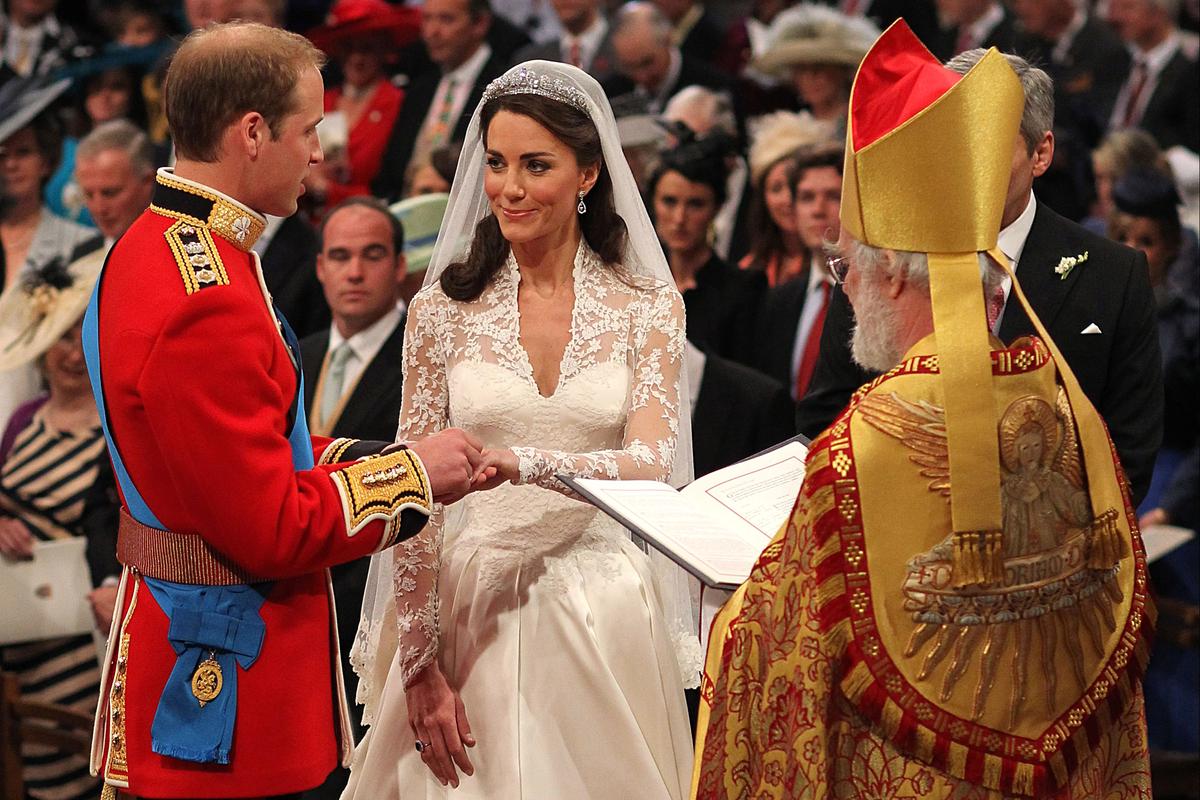Prince William exchanges rings with his bride Catherine Middleton in front of the Archbishop of Canterbury Rowan Williams inside Westminster Abbey in London, England on April 29, 2011.<br/>(Photo by Dominic Lipinski - WPA Pool/Getty Images)