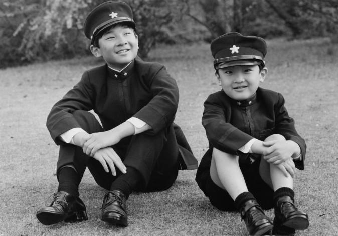 Prince Hiro (left), aka Crown Prince Naruhito of Japan, and his younger brother Prince Aya, aka Prince Akishino, wearing their new school uniforms in the grounds of Togu Palace, Tokyo, 9th April 1972. They have both started at the Gakushuin Junior High School in Tokyo. (Keystone/Hulton Archive/Getty Images)