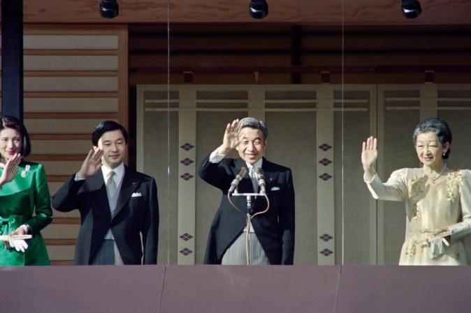Japanese Emperor Akihito (2nd R), Empress Michiko (R), Prince Naruhito and Princess Masako (L) wave from a glass enclosed balcony of the Imperial Palace on January 2, 1994 while receiving New Year's greetings from some tens of thousands people. (Toshifumi Kitamura/AFP/Getty Images)