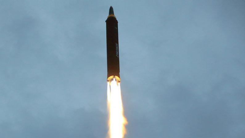 A missile is launched during a long and medium-range ballistic rocket launch drill in this undated photo released by North Korea.
