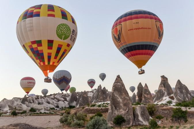 Hot air balloons glide during a flight over Nevsehir in Turkey's historical Cappadocia region, Central Anatolia, on Sept. 5. (YASIN AKGUL/AFP/Getty Images)