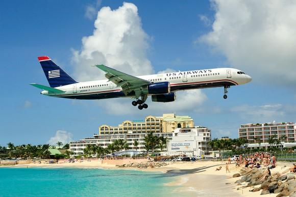 An airplane approaches the runway at Princess Juliana International Airport. (Lawrence Lansing http://picasaweb.google.com/fuzzynerd/)/CC BY 3.0 via Wikimedia Commons)