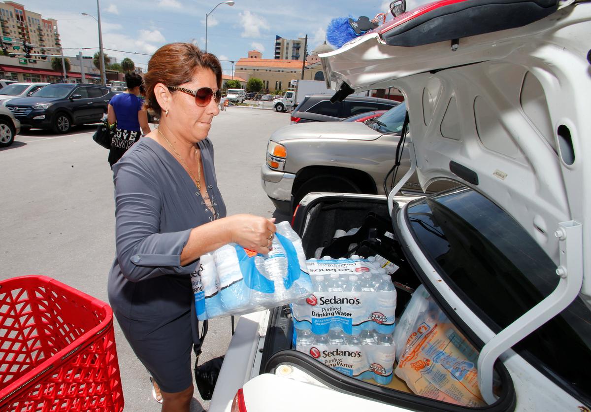 Ligia Marquez loads water she purchased in Sedano's Supermarket in the Little Havana neighborhood in Miami, Florida on Sept. 5, 2017. (REUTERS/Joe Skipper)