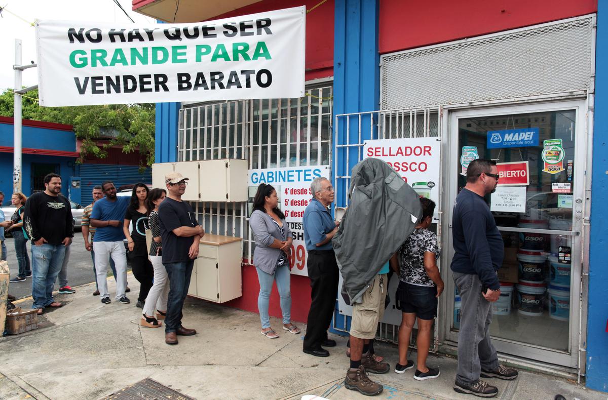 People stand in line outside a hardware store as they prepare for Hurricane Irma, in Bayamon, Puerto Rico on Sept. 5, 2017. (REUTERS/Alvin Baez)