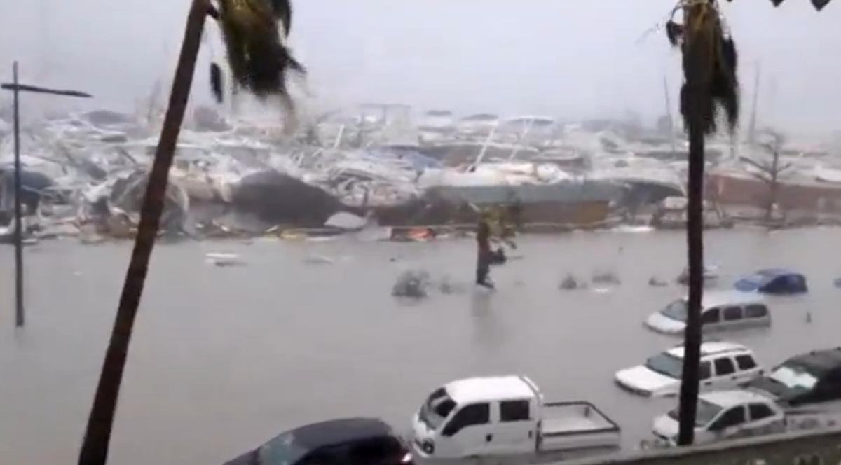 General view of half-submerged vehicles, boats and debris in the flooded harbour as Hurricane Irma hits the French island territory of Saint Martin Sept. 6, 2017. (RCI GUADELOUPE/Handout via REUTERS)