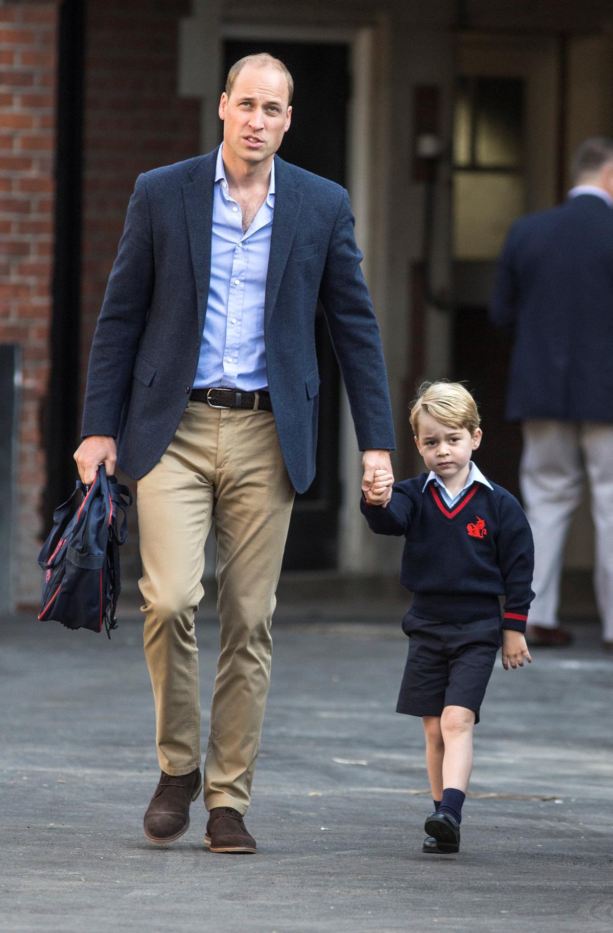 Britain's Prince William accompanies his son Prince George on his first day of school at Thomas's school in Battersea, London, Sept. 7, 2017. (REUTERS/Richard Pohle/Pool)