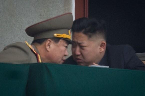 North Korean leader Kim Jong-Un (R) talks to a military aide during an official ceremony at the Kim Il Sung stadium in Pyongyang on April 14, 2012. (Ed Jones/AFP/Getty Images)