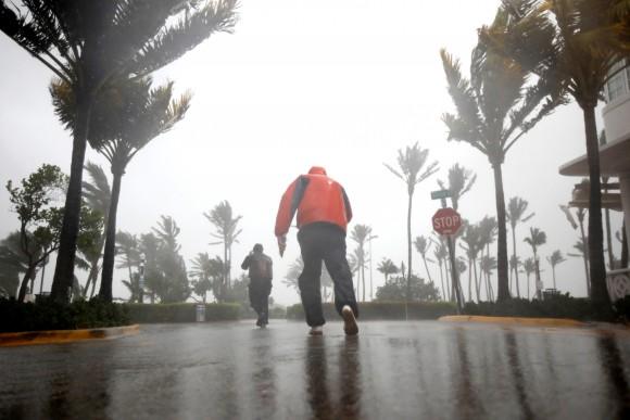 People walk along a street in South Beach as Hurricane Irma arrives at south Florida, in Miami Beach, Florida, U.S., September 10, 2017. (Reuters/Carlos Barria)
