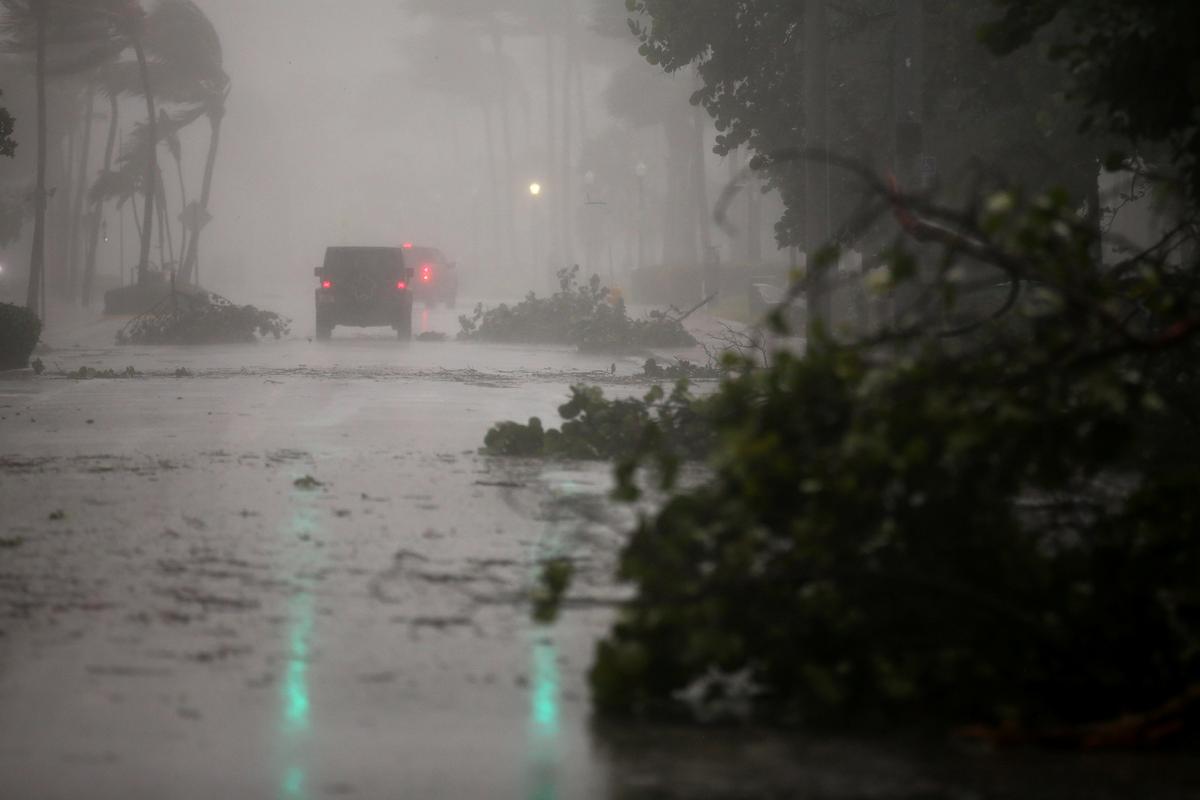 Vehicles drive along Ocean Drive in South Beach as Hurricane Irma arrives at south Florida, in Miami Beach, Florida on Sept. 10, 2017. (REUTERS/Carlos Barria)
