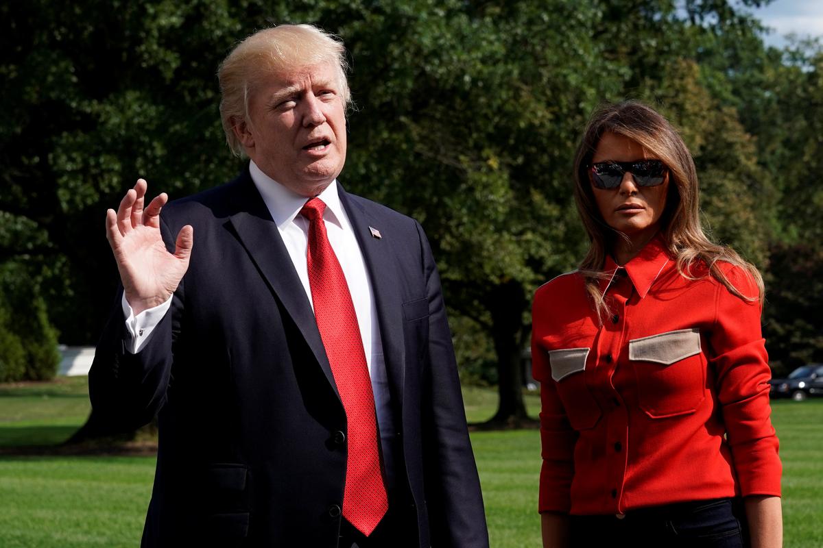 President Donald Trump talks to the media about Hurricane Irma, next to First lady Melania Trump, on the South Lawn of the White House upon their return to Washington from Camp David on Sept. 10, 2017. (REUTERS/Yuri Gripas)