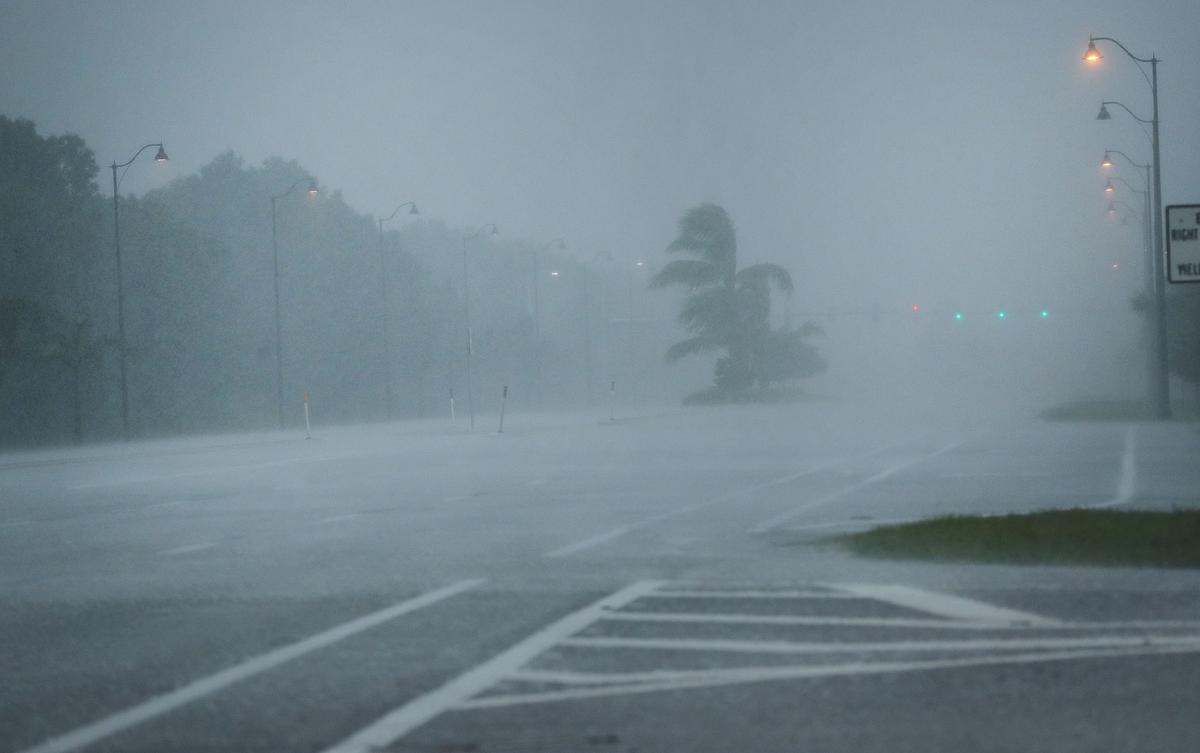 Rain and wind sweep over empty roads as Hurricane Irma arrives into southwest Florida in Bonita Springs, Florida on Sept. 10, 2017. (Photo by Spencer Platt/Getty Images)