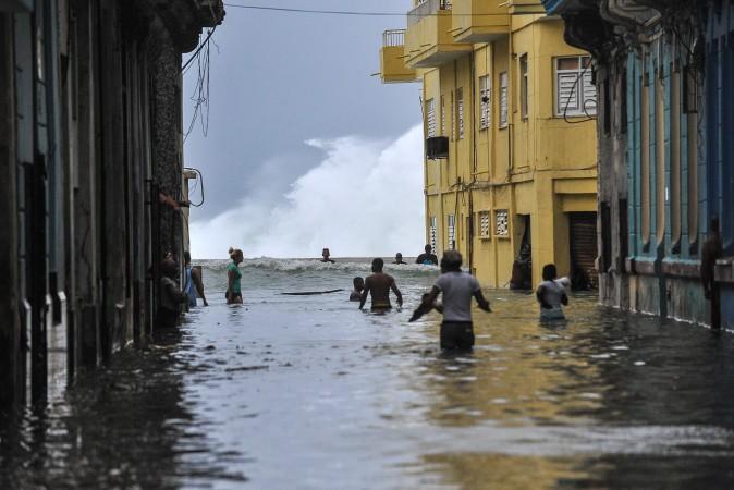Cubans wade through a flooded street near the Malecón in Havana on Sept. 10, 2017, after Hurricane Irma battered central Cuba on Saturday. (YAMIL LAGE/AFP/Getty Images)