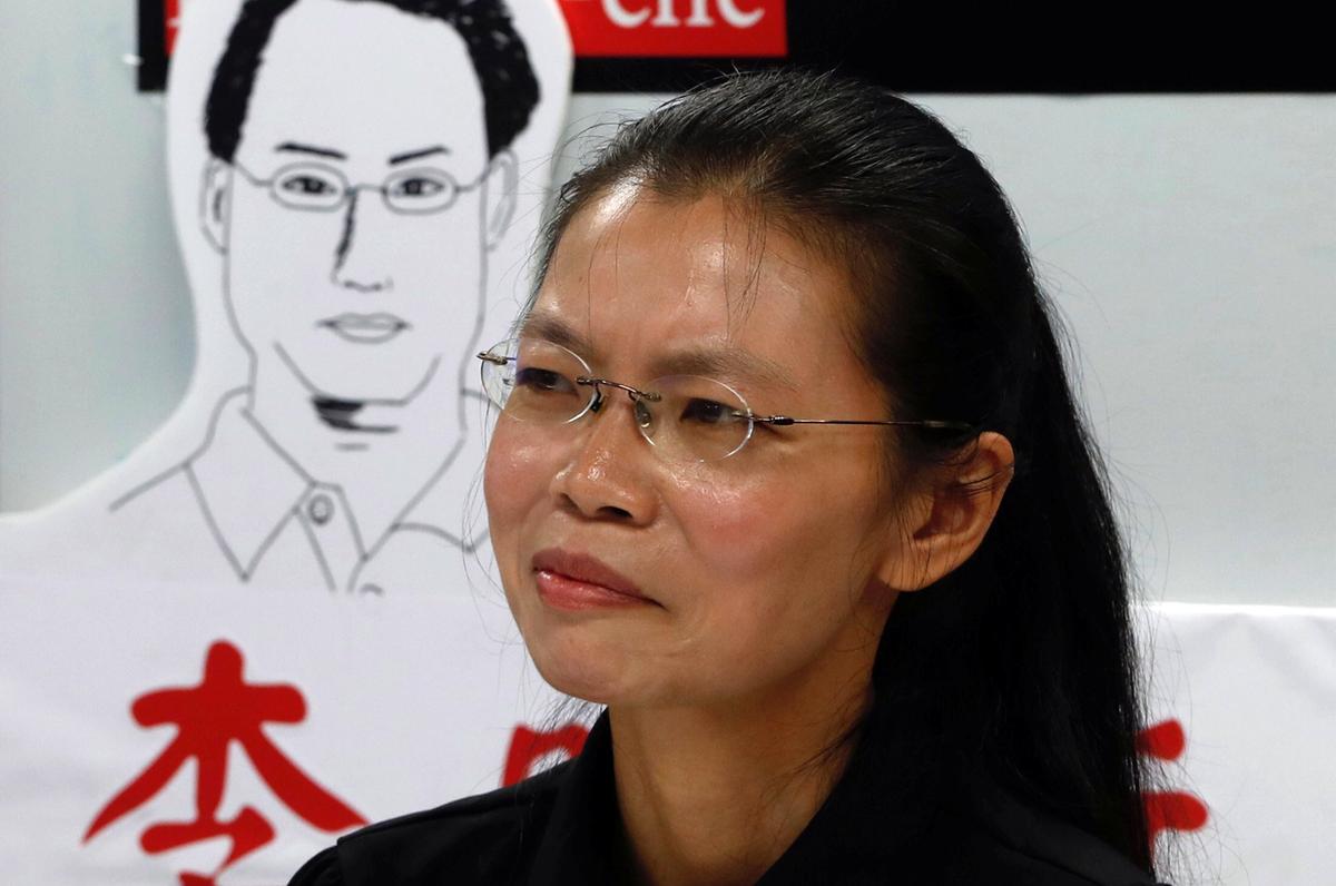 Lee Ching-yu, wife of Taiwan human rights advocate Lee Ming-che, who has been detained in China, speaks to the media a day before departing for her husband's trial, in Taipei, Taiwan on Sept. 9, 2017. (REUTERS/Tyrone Siu)