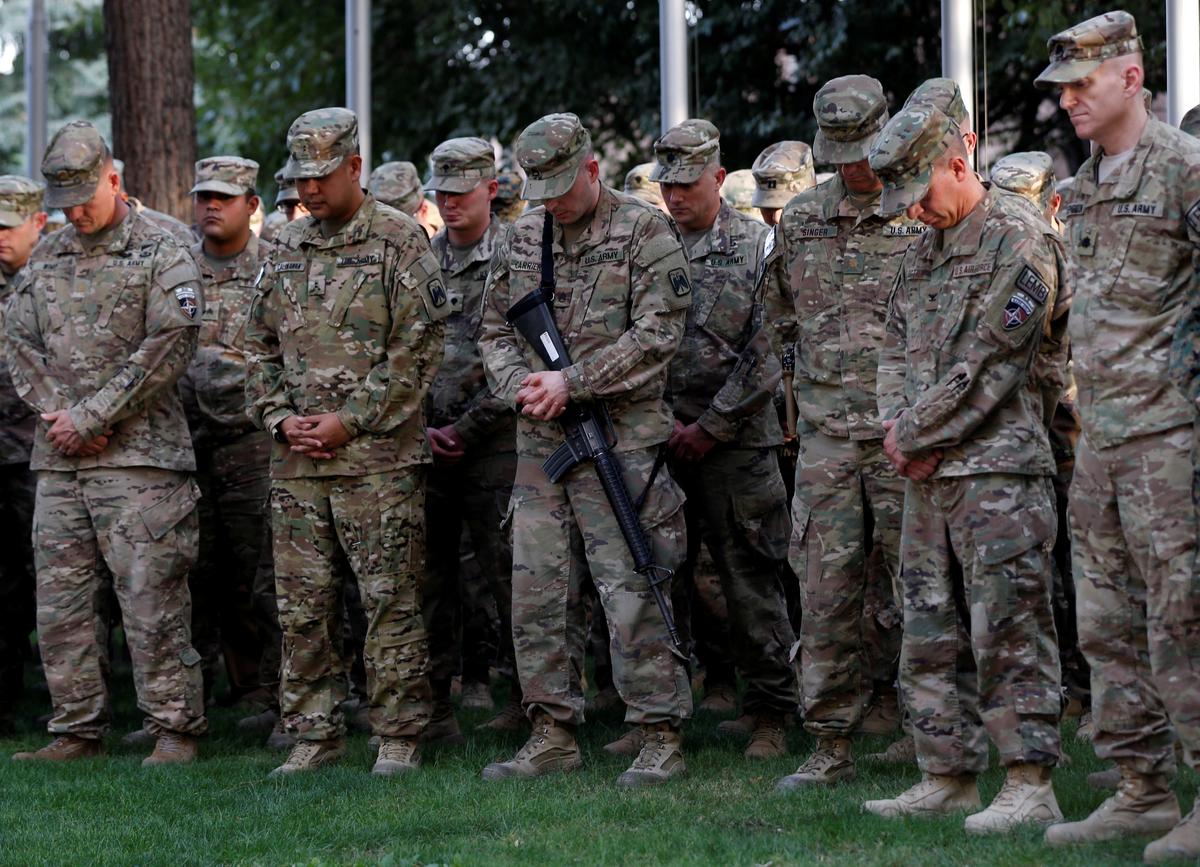 U.S. soldiers take part in a memorial ceremony to commemorate the 16th anniversary of the 9/11 attacks, in Kabul, Afghanistan on Sept. 11, 2017. (REUTERS/Mohammad Ismail)