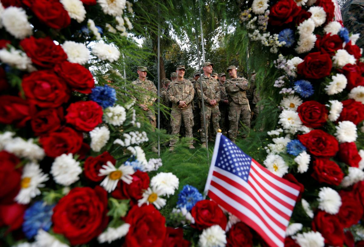 U.S. soldiers take part in a memorial ceremony to commemorate the 16th anniversary of the 9/11 attacks, in Kabul, Afghanistan on Sept. 11, 2017. (REUTERS/Mohammad Ismail)