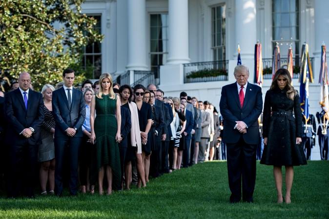 (L-R) National Economic Council Director Gary Cohn, Senior Adviser Jared Kushner, Ivanka Trump, President Donald Trump and first lady Melania Trump participate in a moment of silence on the South Lawn of the White House during a memorial service for the 9/11 terrorist attacks Sept. 11, 2017.  (Brendan Smialowski/AFP/Getty Images)