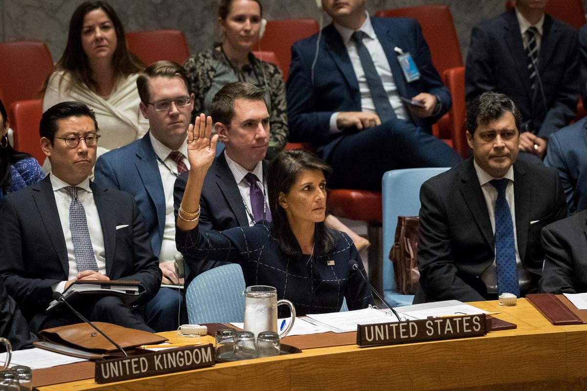 Nikki Haley, United States ambassador to the United Nations, raises her hand as she votes yes to levy new sanctions on North Korea designed to curb their nuclear ambitions during a meeting of the United Nations Security Council concerning North Korea at UN headquarters in New York City on Sept. 11, 2017. (Photo by Drew Angerer/Getty Images)
